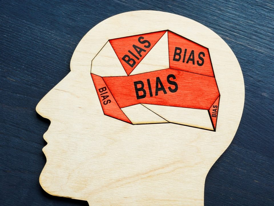 Head profile with the words bias in red